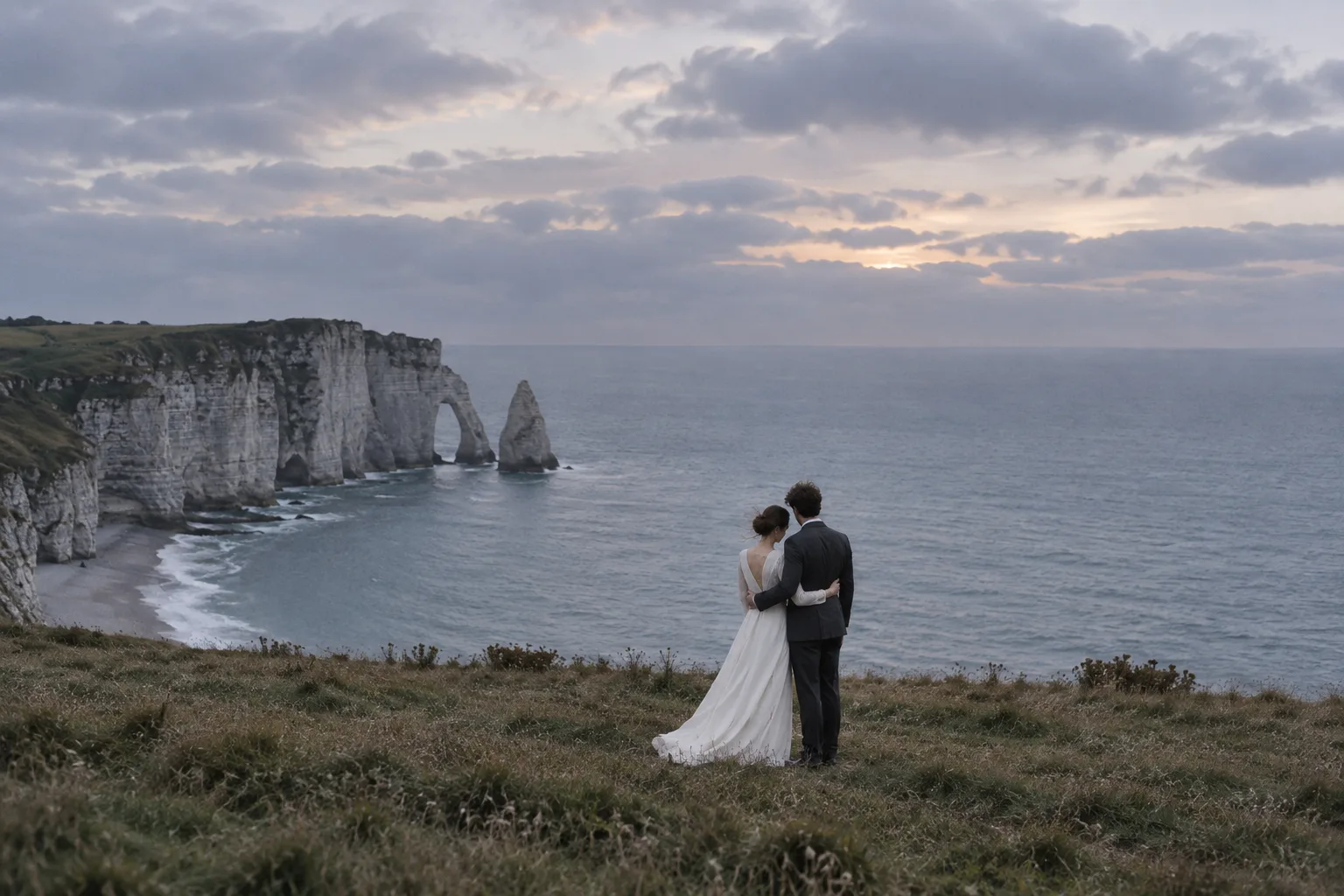 The couple looking over the sea at twilight